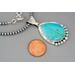 penny next to pendant
